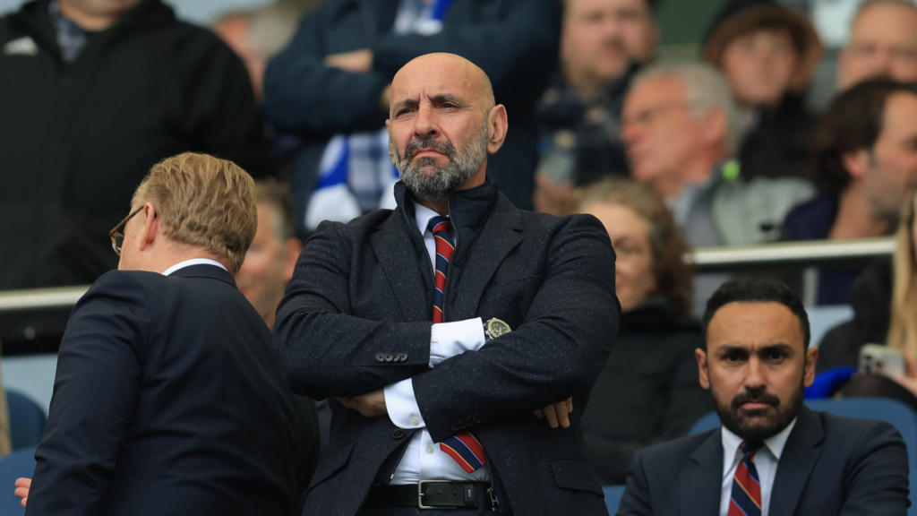 Aston Villa president Monchi stands with his arms folded.