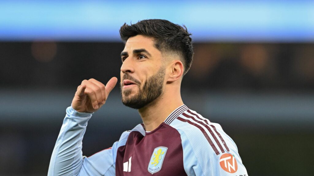 Marco Asensio Aston Villa celebrates a goal by imitating a phone with his hand.