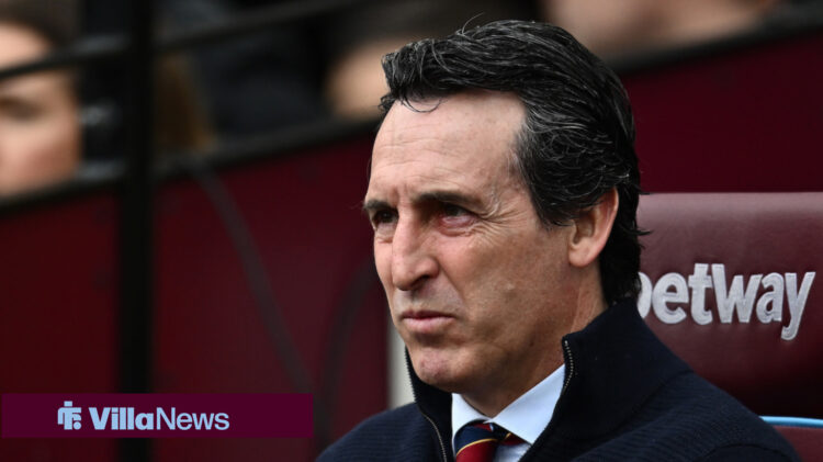 Aston Villa manager Unai Emery sitting in a dugout.
