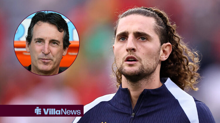 Adrian Rabiot looks towards Unai Emery who smiles.
