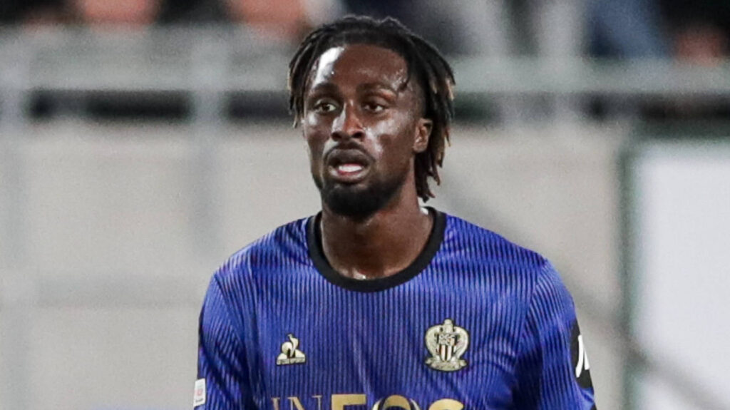 Evan Guessand playing for Nice in their blue strip