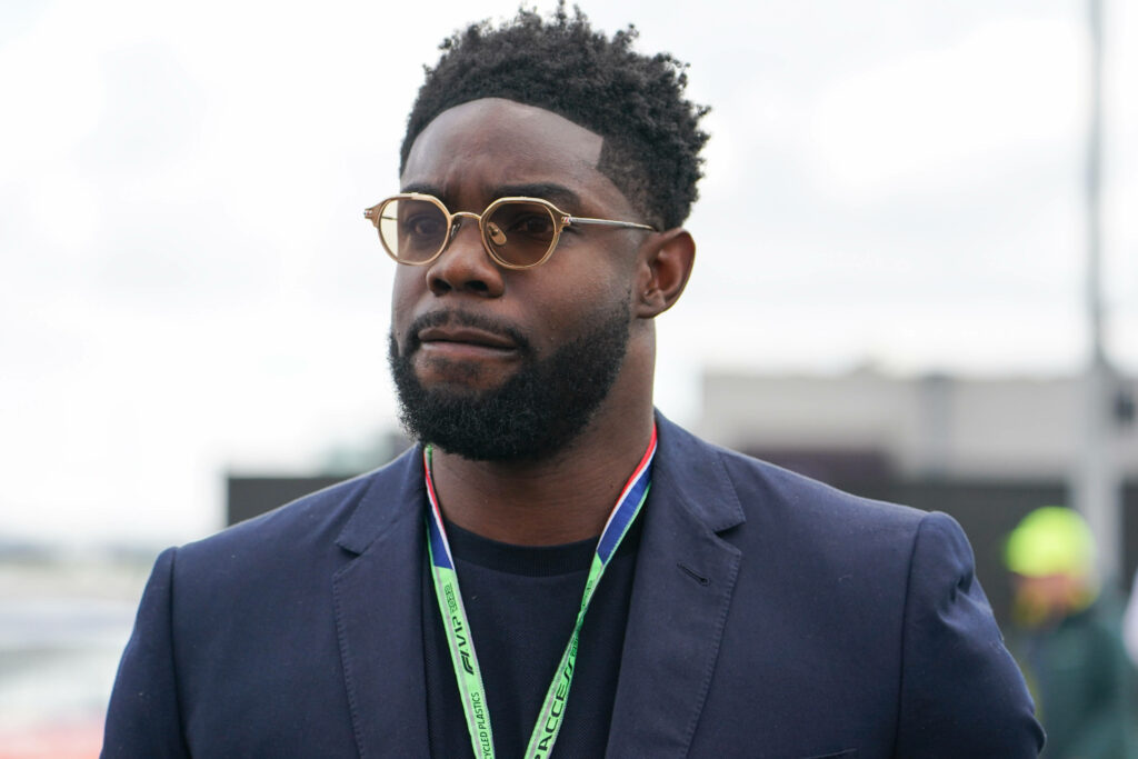 Micah Richards walking while at the British Grand Prix in 2022