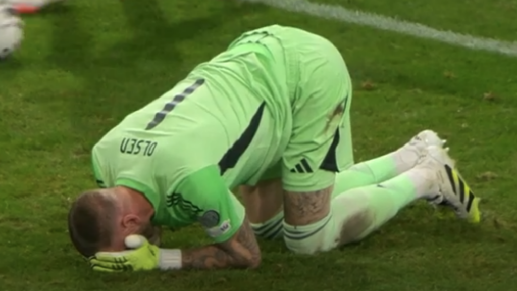 Robin Olsen with his head in his hands while playing for Sweden