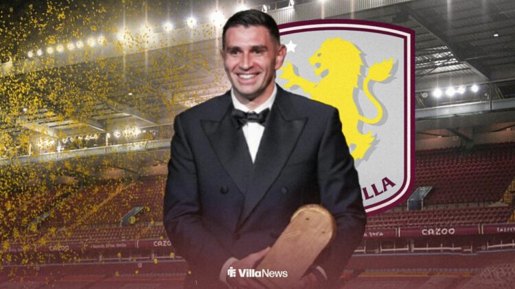 Emi Martinez holding the Yashin Trophy award in front of the Aston Villa badge at Villa Park