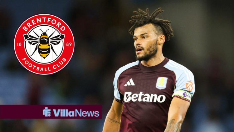 Tyrone Mings in action for Aston Villa, Brentford badge in a circular insert.