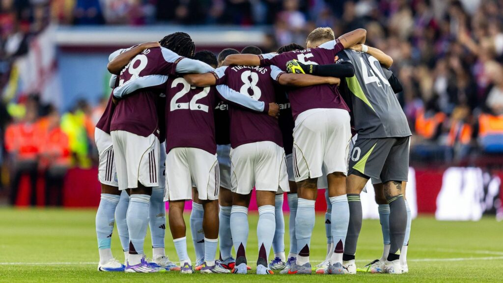Aston Villa squad in a huddle at Villa Park