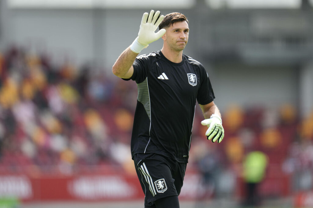 Emi Martinez in Aston Villa training gear while waving