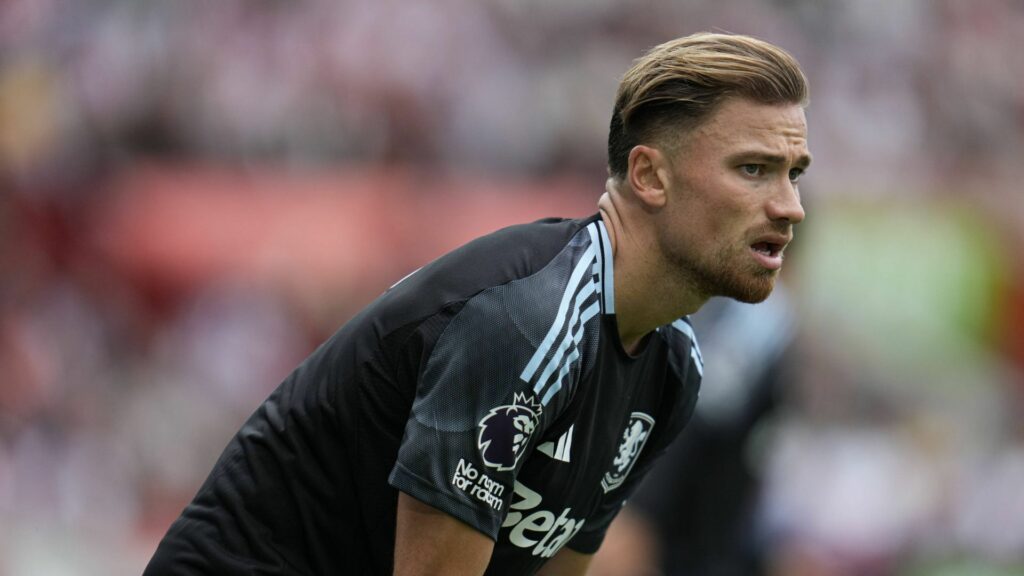 Matty Cash playing for Aston Villa looking concerned