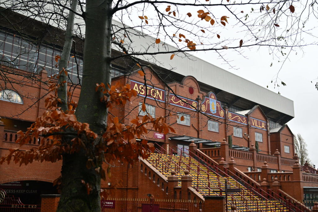 The Holte End at Villa Park behind a tree in winter