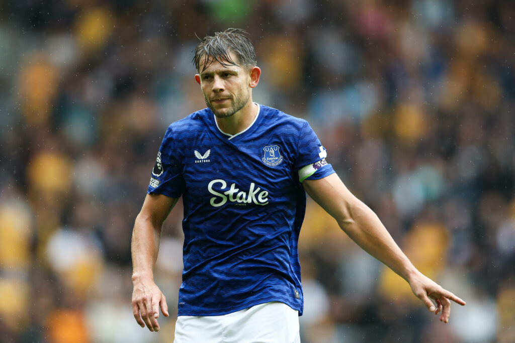 James Tarkowski playing for Everton pointing away from his body