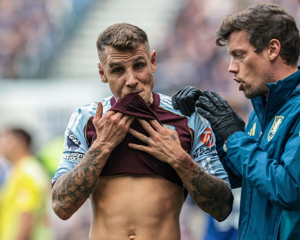 Lucas Digne receiving medical treatment at Aston Villa