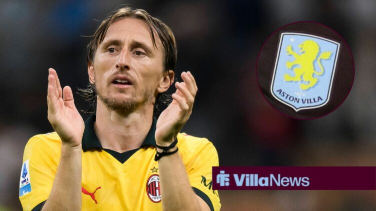 Luca Modric clapping while looking away from an Aston Villa badge in a circle inset