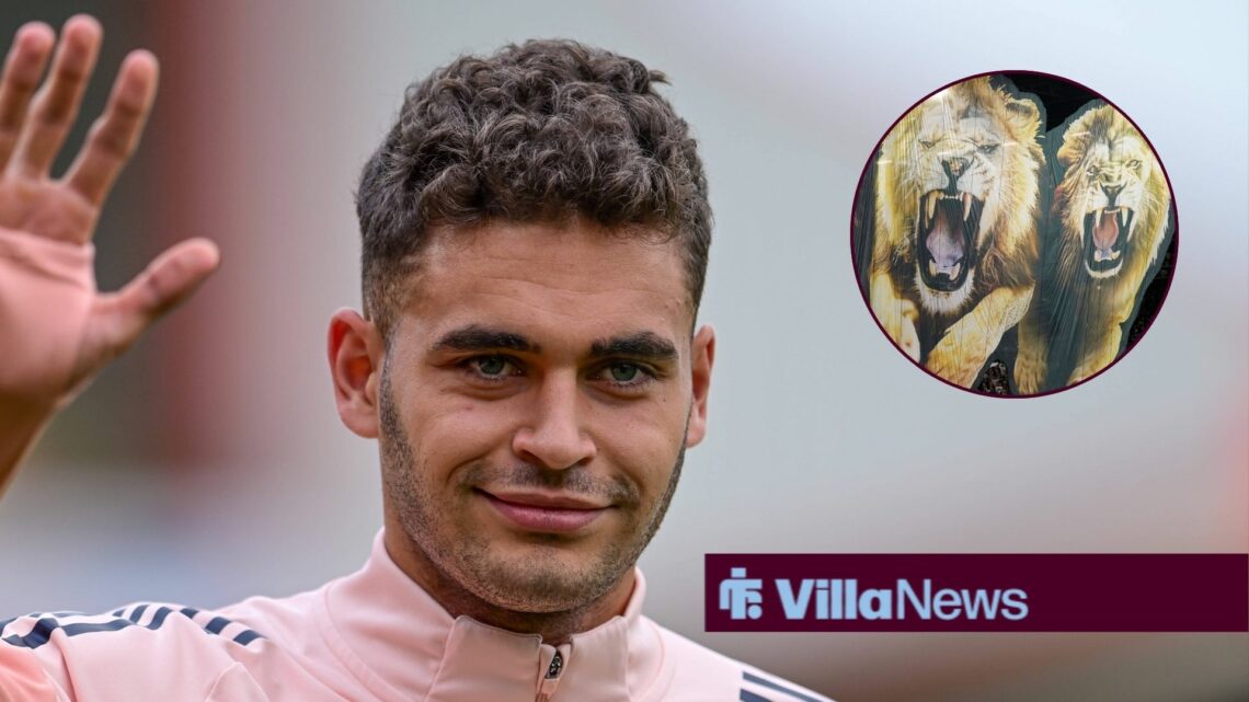 Andres Garcia in Aston Villa training gear waving looking towards a lion tifo at Villa Park