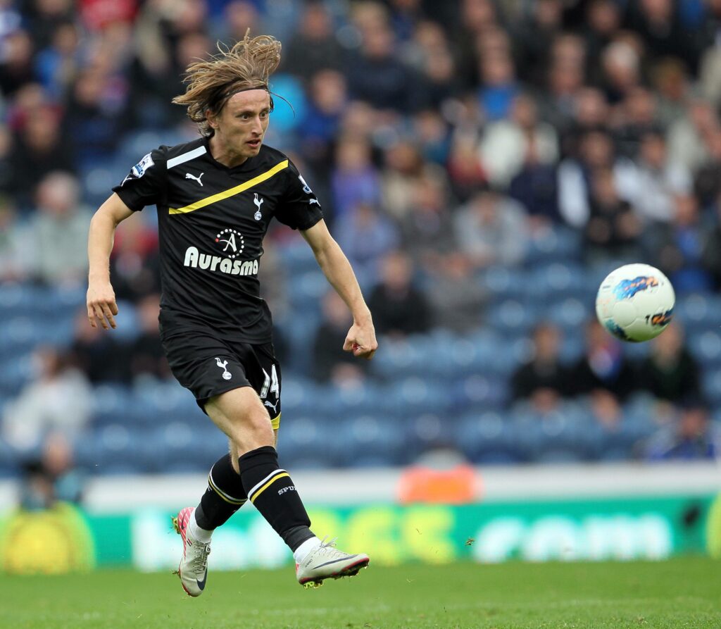 Luka Modric playing for Tottenham kicking the ball in the air