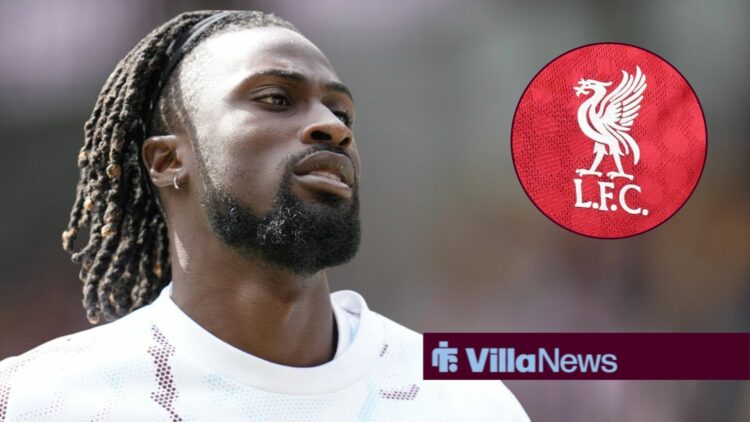 Evann Guessand looking annoyed playing for Aston Villa looking towards a Liverpool badge