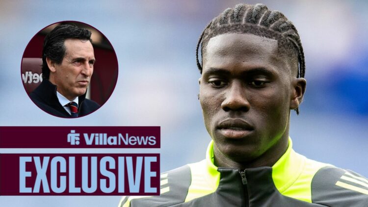 Villa News exclusive as Aston Villa star Amadou Onana stares at the ground while warming up for a game, as manager Unai Emery watches on from a cir...