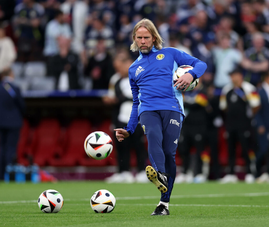 Austin MacPhee kicking a ball in training with Scotland