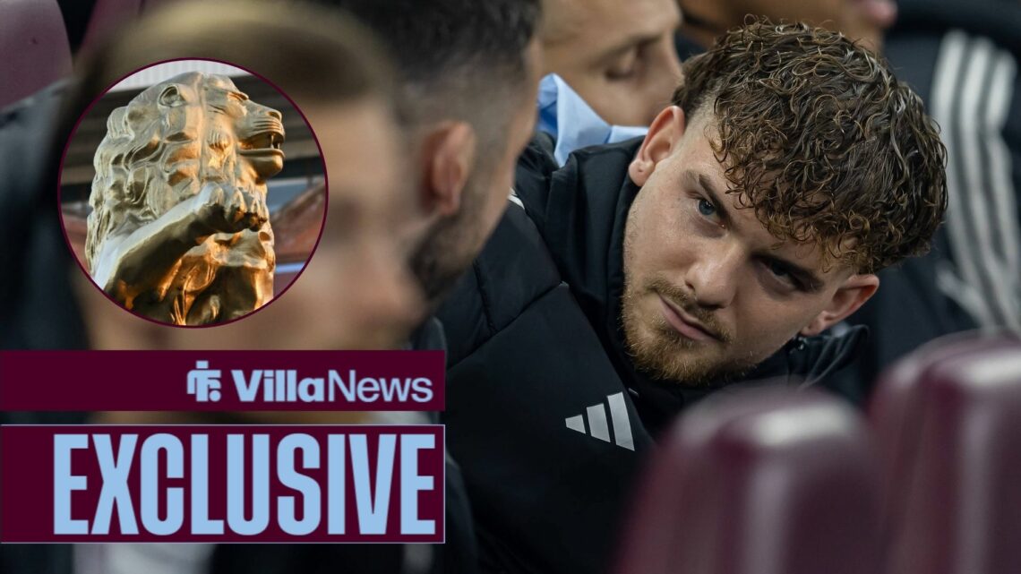 Harvey Elliott sitting on the bench for Aston Villa looking towards a circle inset of a lion at Villa Park