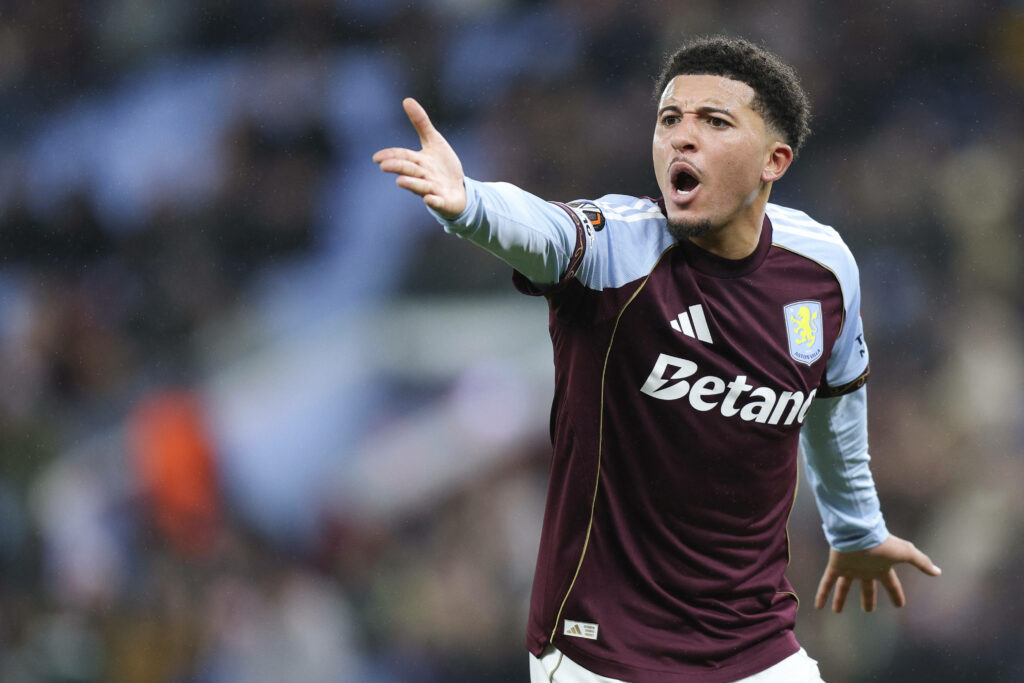 Jadon Sancho looking annoyed pointing his hand at Aston Villa