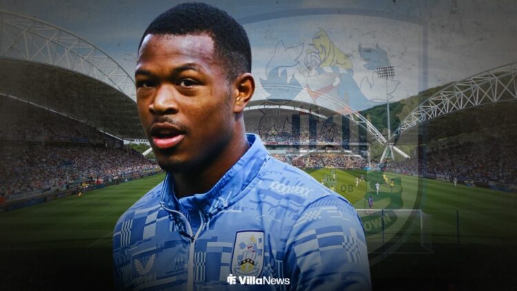 Zepiqueno Redmond playing for Huddersfield stadning infront of the Accu Stadium