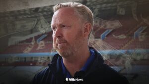 Chris Heck speaking at Villa Park surrounded by falling money notes