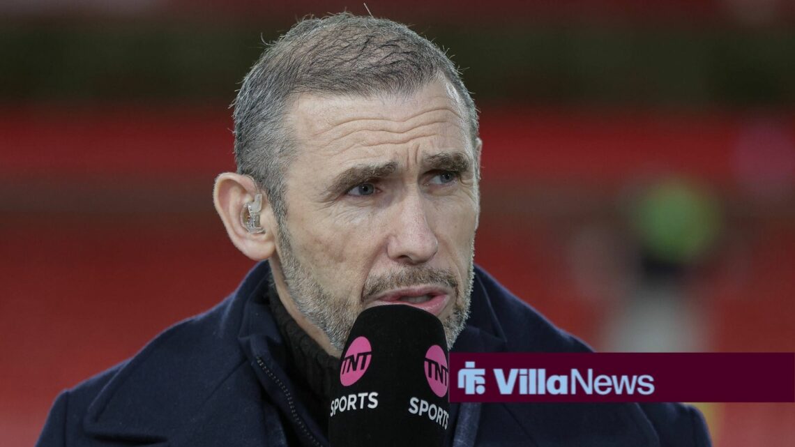 Martin Keown with a microphone to his mouth.