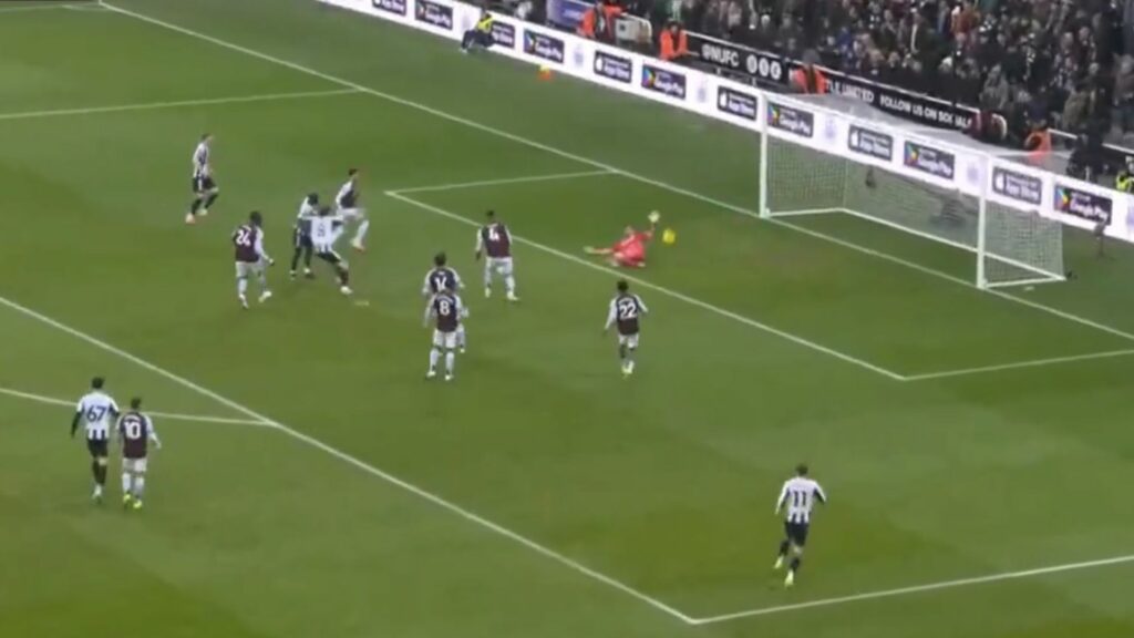 Emi Martinez making a save for Aston Villa from Sandro Tonali of Newcastle United