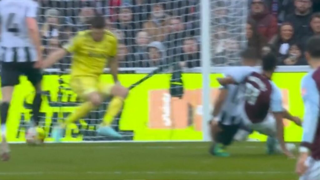 Nick Pope making a save for Newcastle United from Ollie Watkins of Aston Villa