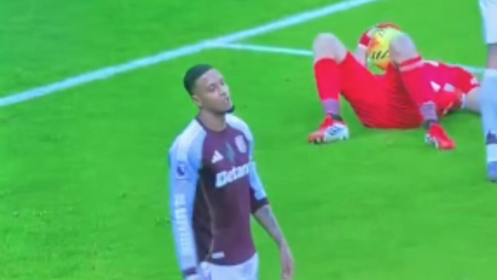 Ezri Konsa looking annoyed for Aston Villa after Emi Martinez went down for Aston Villa