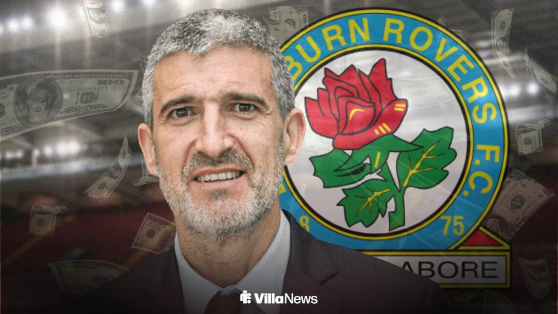 Roberto Olabe at Villa Park next to the Blackburn Rovers badge and falling bank notes