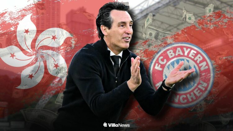 Unai Emery clapping at Aston Villa alongside the Hong Kong flag and Bayern Munich badge at the Hong Kong Stadium
