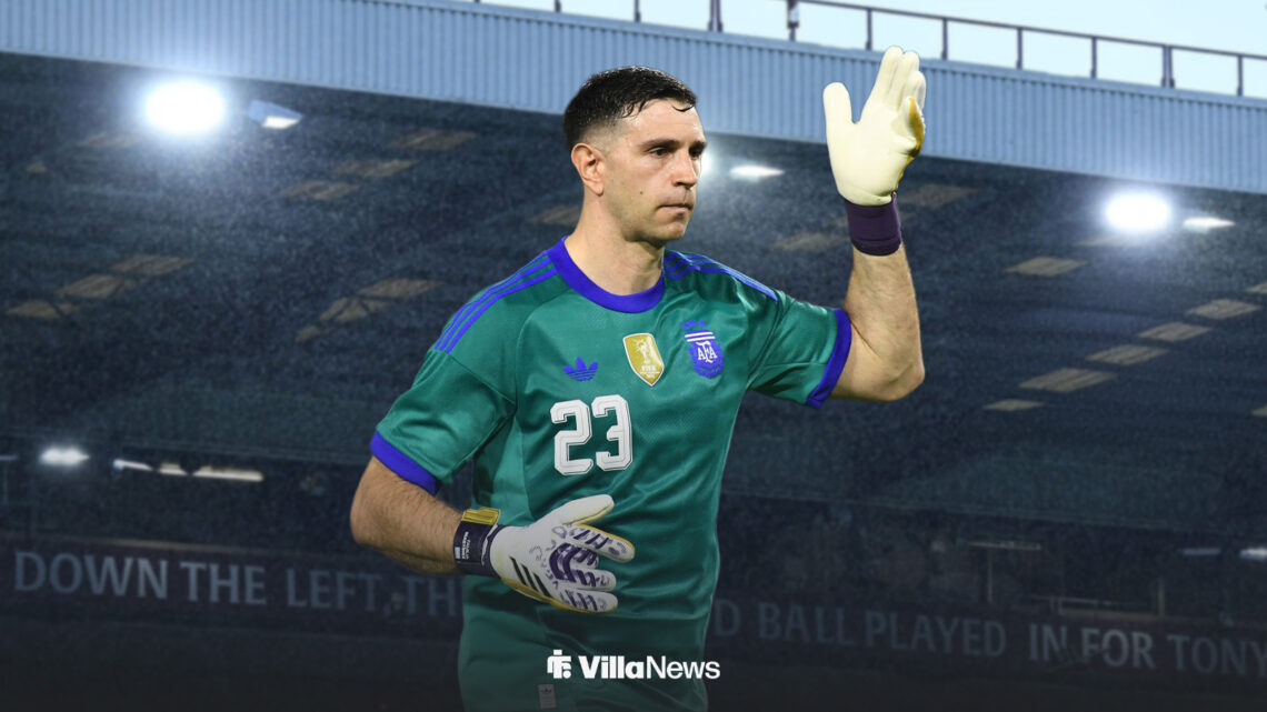 Aston Villa goalkeeper Emi Martinez looks dejected while playing for Argentina, against a Villa Park backdrop