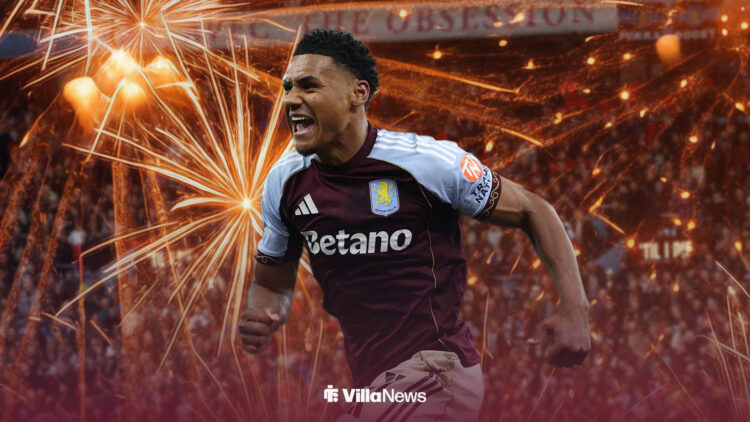 Ollie Watkins celebrates, with fireworks going off around him